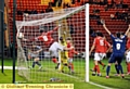 NET BUSTER: James Tarkowski (left) wheels away after putting Athletic in front last night. 