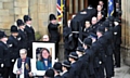 The coffin of Pc Fiona Bone is carried from Manchester Cathedral following her funeral service. 