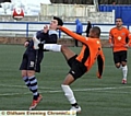 Hollinwood's Mark Pyatt (left) is challenged by Woodley's Lewis Graham 