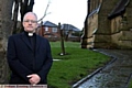 FENCE protection: the Rev Peter McEvitt at Holy Trinity Church in Shaw 
