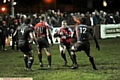 PLOUGHING FORWARD: Oldham’s Neil Rigby shows aggression and desire to break through the Saints defence. 
