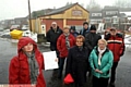 WORRY: Karen Turner (front left) and her letter of objection with other local residents and councillors outside the former Den Lane garage 
