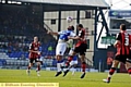 AERIAL COMBAT . . . Athletic striker Reuben Reid attempts to win a header. 