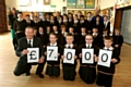WE did it! Deputy head Steve Hill with pupils Ellie Mellor, Ethan Kershaw, Hannah Hilton and Lewis Varley with fellow pupils at St Joseph’s 
