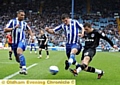 BUNN FIGHT... Athletic’s on-loan striker Harry Bunn shows the desire to push into the heart of the Wednesday defence. 
