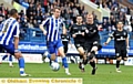 NO WAY THROUGH . . . Robbie Simpson looks to break Athletic’s goalless streak at Hillsborough yesterday. 
