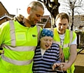 REUNITED . . . workmen Dave Vaughan (l) and Darren Paton with delighted Diane 
