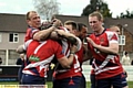 TRY TIME: Playerss celebrate Miles Greenwood’s try — Oldham’s fourth 