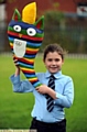 Ella White and her winning torch 
