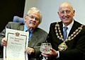 PROUD: Harry Burns receives the award from the Mayor, Councillor Richard Knowles 
