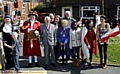 COMMUNITY spirit . . . residents of Tulpen Square, Chadderton with Town Cryer Reg Lord 