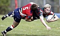 Shaun Robinson flies into a tackle to stop Skolars’ John Paxton in his tracks. 