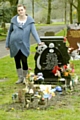 HEARTBROKEN . . . Rachel Heywood at the grave of her baby son Jack in Lees Cemetery, where callous thieves stole toys and mementoes. 
