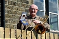 BEST of brass . . . a proud Patrick with his medallion 
