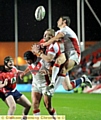 STUCK IN THE MIDDLE . . . Oldham’s Matt Fogarty (centre) is caught between Saints’ Tommy Makinson (right) and Jonny Lomax. 