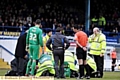 CONCERN . . . paramedics attend to Youssouf Mchangama at Gigg Lane on Saturday.