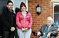 Jodie Cook at her new home with Phil Royle, FCHO Neighbourhood Officer (left) and Harry Burns, Chair of the Board at FCHO. 