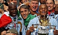 PLENTY TO SMILE ABOUT: boss Roberto Mancini and captain Vincent Kompany celebrate City’s last-gasp glory. 