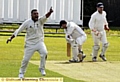 NOT OUT . . . Heyside opening batsman John Selby survives an appeal from Friarmere bowlerAzim Naseer.