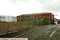 EYESORE . . . the empty site of the former Clarksfield Conservative Club with dilapidated Bank Mill next door 