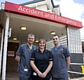 NEW and improved: (from left) Dr Tom Leckie, Julie Winterbottom and Dr Nick Gili outside the A&E department at The Royal Oldham Hospital 
