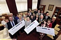 Oldham Mayor Cllr Richard Knowles presents his year's cheques to local charities.
