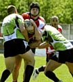 STOP RIGHT THERE . . . Oldham’s Michael Ward sees his path blocked by two South Wales Scorpions players. 