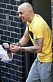NO remorse: a grinning Robert Hutchinson in handcuffs as he leaves Mold Crown Court after being jailed for 10 years 
