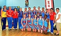 PROUD . . . Asha Francis (left), of Team Bath, is pictured with the players and coaches of Oldham under-14s. 