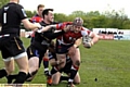 UP FOR THE BATTLE: Chris Clarke tries to beat the tackles for Oldham. 