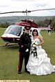 FLYING entrance: Chris and Nicola arrive by helicopter. 
