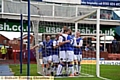 WELL DONE, MATE: James Tarkowski is congratulated by his Athletic team-mates after opening the scoring. 