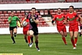 Oldham’s John Gillam makes a break against North Wales Crusaders. 