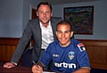 SIGN HERE: new boy Connor Brown completes the formalities with Athletic boss Paul Dickov. 