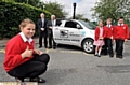 DRIVING FORCE: the new School Safety Vehicle gets the thumbs-up from Casey Devine (front), whose successful campaign led to its introduction 