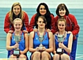 A Glorious hat-trick for Oldham netball. Pictured are Debbie Hallas (back row, left, National Premier League Division One coach), Pam Hazelton (head coach), Jackie Reid (head junior coach), with (front, left to right), captains Gabriella Marshall (under-16s), Kerry Almond (seniors) and Abigail Tyrrell (under-14s)

