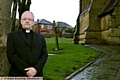 Father Peter McEvitt at Holy Trinity Church, Shaw, where more security measures are to be taken 