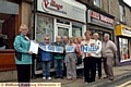 Councillors Val Sedgwick and Barbara Beeley have started a petition to stop another takeaway opening in premises formerly used by a mobile phone shop — and next to an existing takeaway. Val said: “We've got too many takeaways and we don't need another one. On Friday and Saturday nights you can see the food containers all over the place.” Pictured are Councillors Sedgwick (left) and Beeley (third right) with supporters. 
