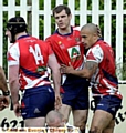BRIGHT . . . Miles Greenwood (right) receives a pat on the head from John Gillam after scoring Oldham’s only try. 