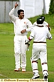 OFF TO A FLIER: Oldham debutant Furrukh Bukhari celebrates taking the wicket of ex-Pollards captain Chris McDonnell, who was caught by another new man, Naeem Ashraf. 
