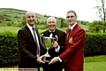 DRESSED FOR SUCCESS: Steven Smith (centre) receives the trophy from Evening Chronicle editor David Whaley (left) and Oldham captain Barry Lewis.