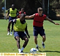 Youssouf Mchangama manages to get a pass away before Kirk Millar can get to him during training in Portugal. 