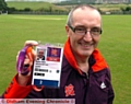 READY FOR ACTION: Steve Grice shows off his pass for the Olympics soccer. 