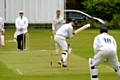 CLEANED UP . . . Heyside’s John Selby looks back in anguish as his middle stump is removed by Greenfield’s Josh Higgins. 