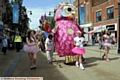 THE Owlympic procession takes to the streets.  