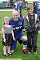 BRAVE: Andy Ritchie with Jack and Jodie Heaton, brother and sister of Jamie Heaton, who led the teams on to the pitch. 