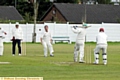 ONE THAT GOT AWAY: Crompton bowler Carl Taylor watches the ball fly past him off the bat of Oldham’s Atif Bajwa. 