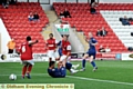 AND THAT MAKES THREE: Robbie Simpson slots the ball home. 