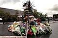 POIGNANT TRIBUTE: wellwishers have paid their respects with flowers near the scene of the blast 
