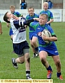 JOSH ALLEN of Waterhead hands off his Saddleworth opponent in the Year Sevens final. 